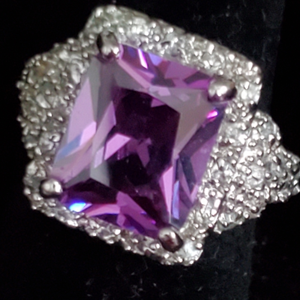 Silvertone ring with large rectangular purple stone and faux diamonds 6 3/4